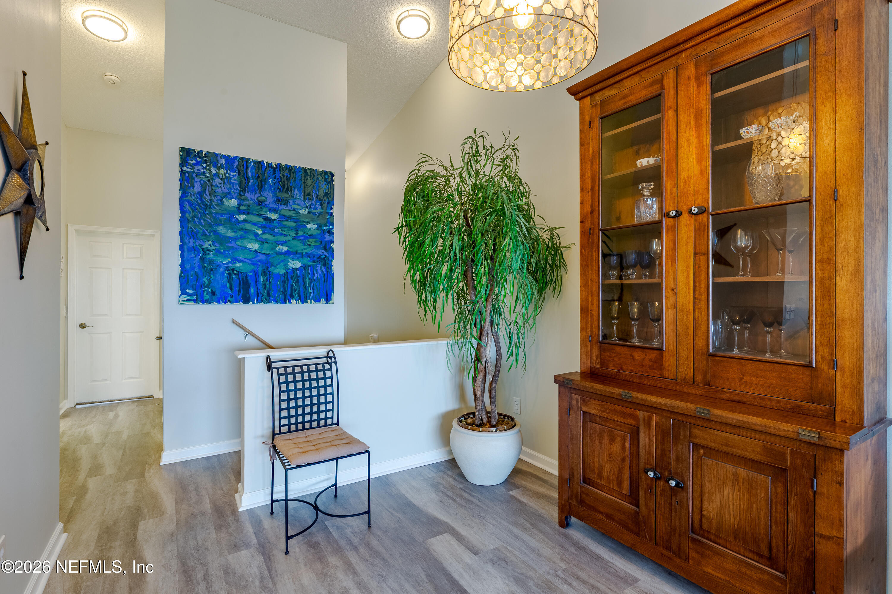 3327 Lighthouse Point Lane Jacksonville, FL 32250 - Photo 23 of 56 a living room with furniture and a potted plant