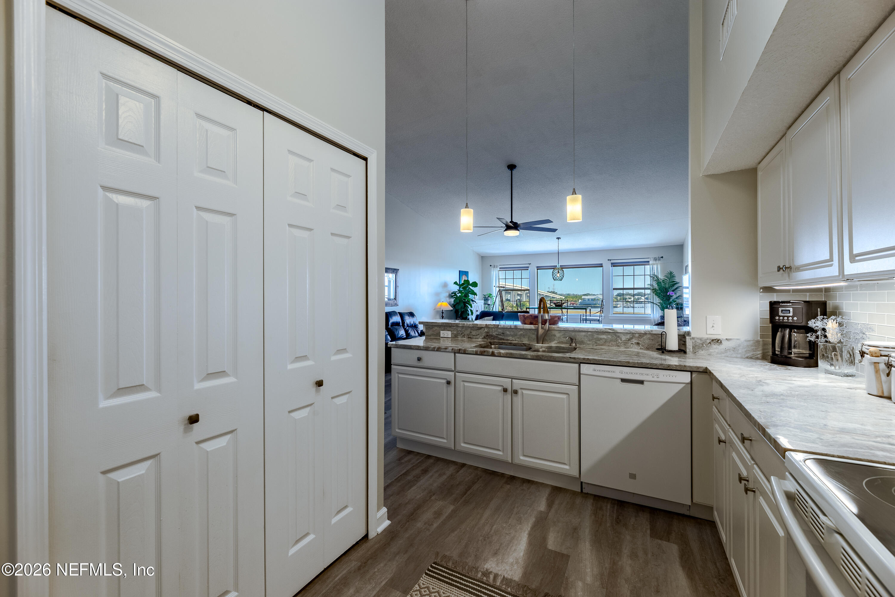 3327 Lighthouse Point Lane Jacksonville, FL 32250 - Photo 25 of 56 a kitchen with cabinets and stainless steel appliances