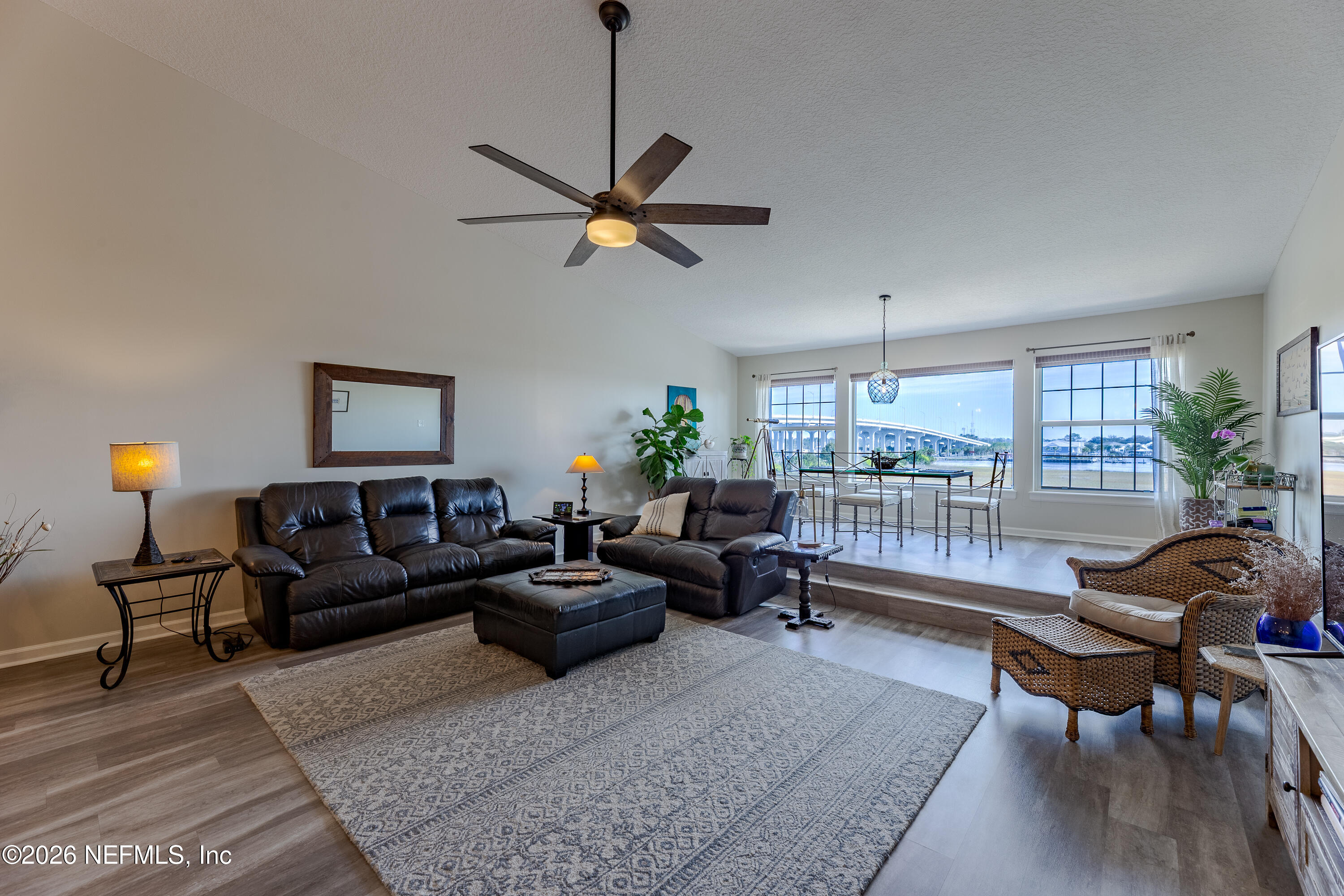 3327 Lighthouse Point Lane Jacksonville, FL 32250 - Photo 31 of 56 a living room with furniture and a window