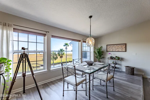 a dining room with furniture window wooden floor