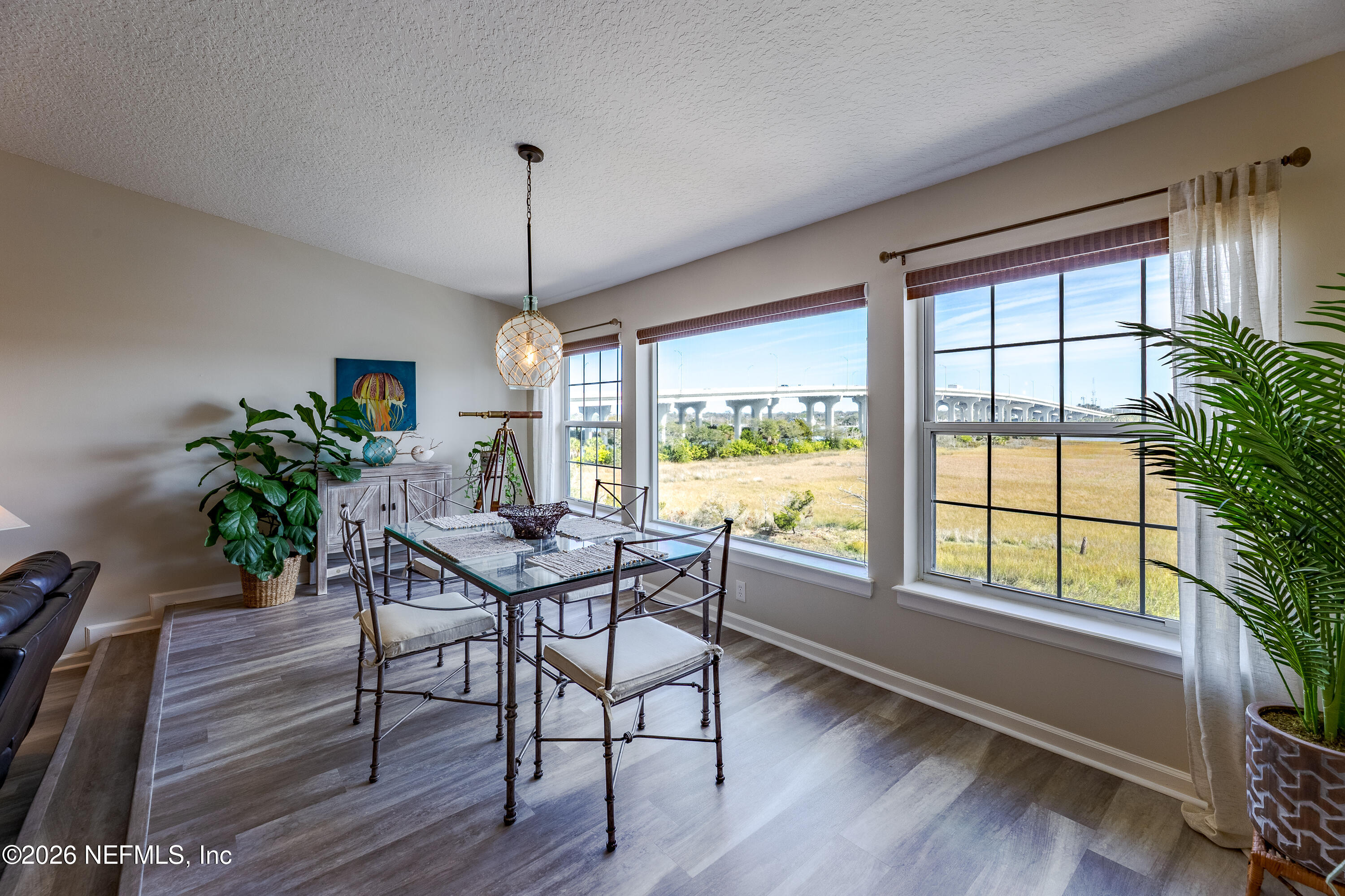 3327 Lighthouse Point Lane Jacksonville, FL 32250 - Photo 35 of 56 a dining room with furniture window wooden floor
