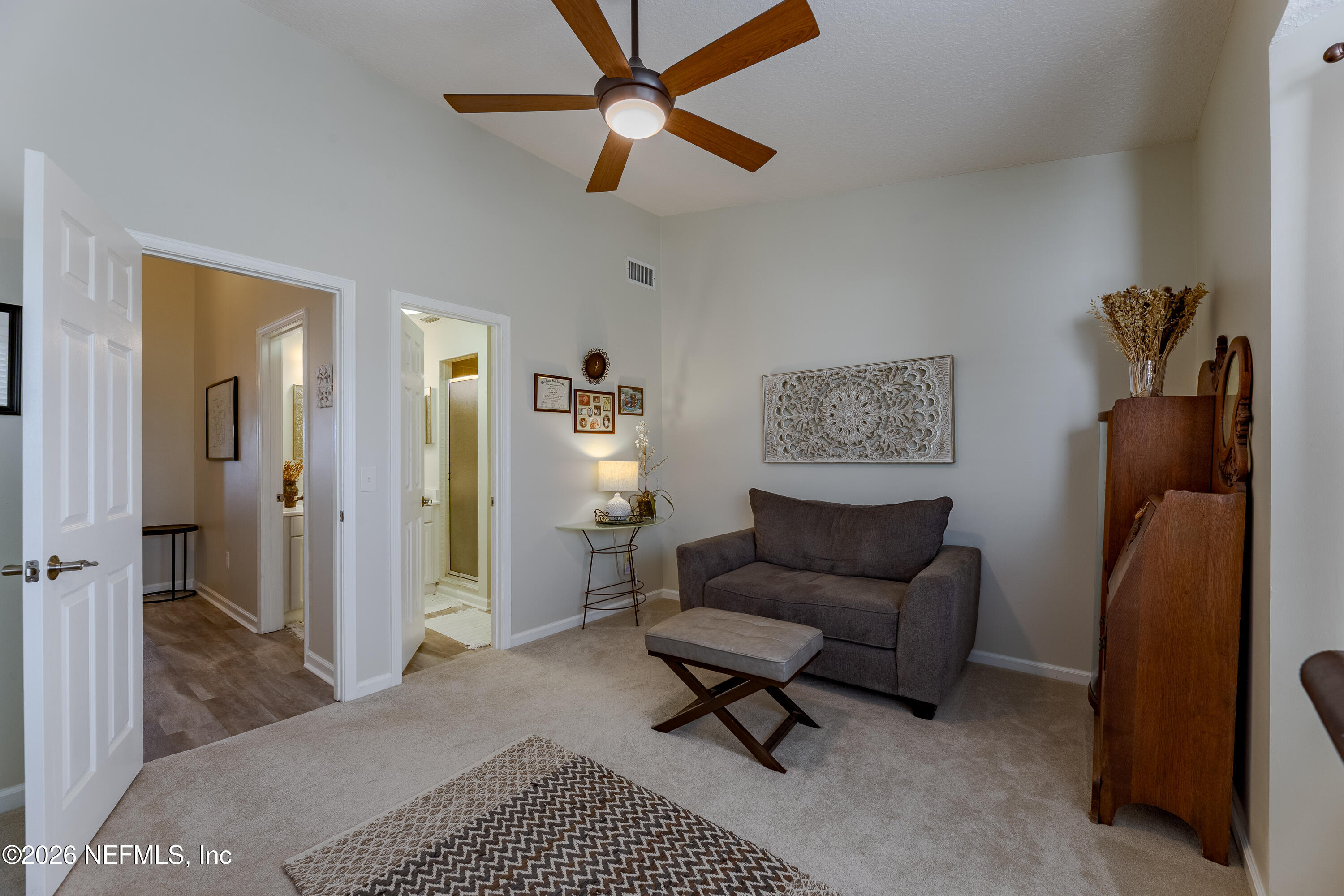 3327 Lighthouse Point Lane Jacksonville, FL 32250 - Photo 38 of 56 a living room with furniture and a rug