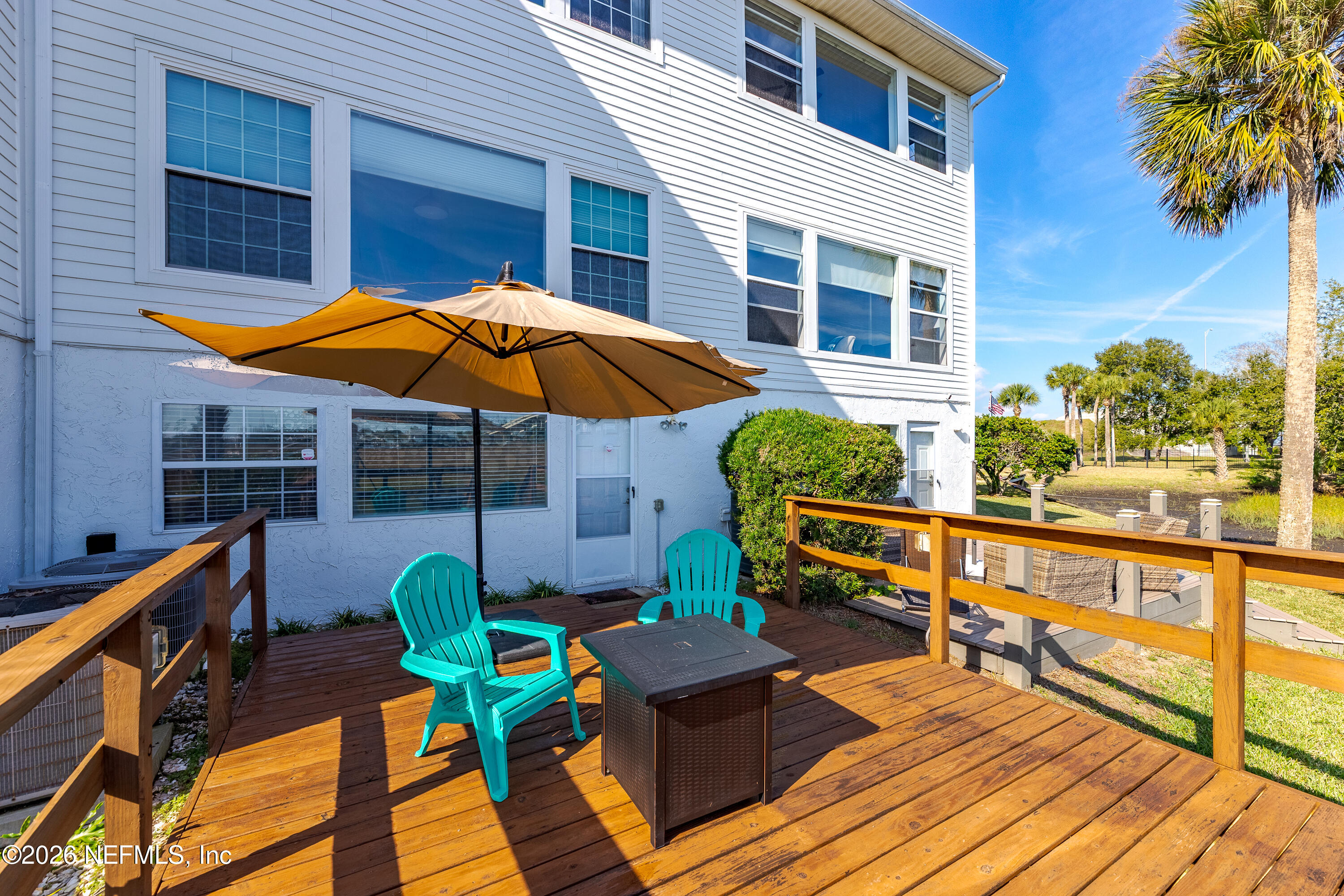 3327 Lighthouse Point Lane Jacksonville, FL 32250 - Photo 42 of 56 a view of a chairs on the deck