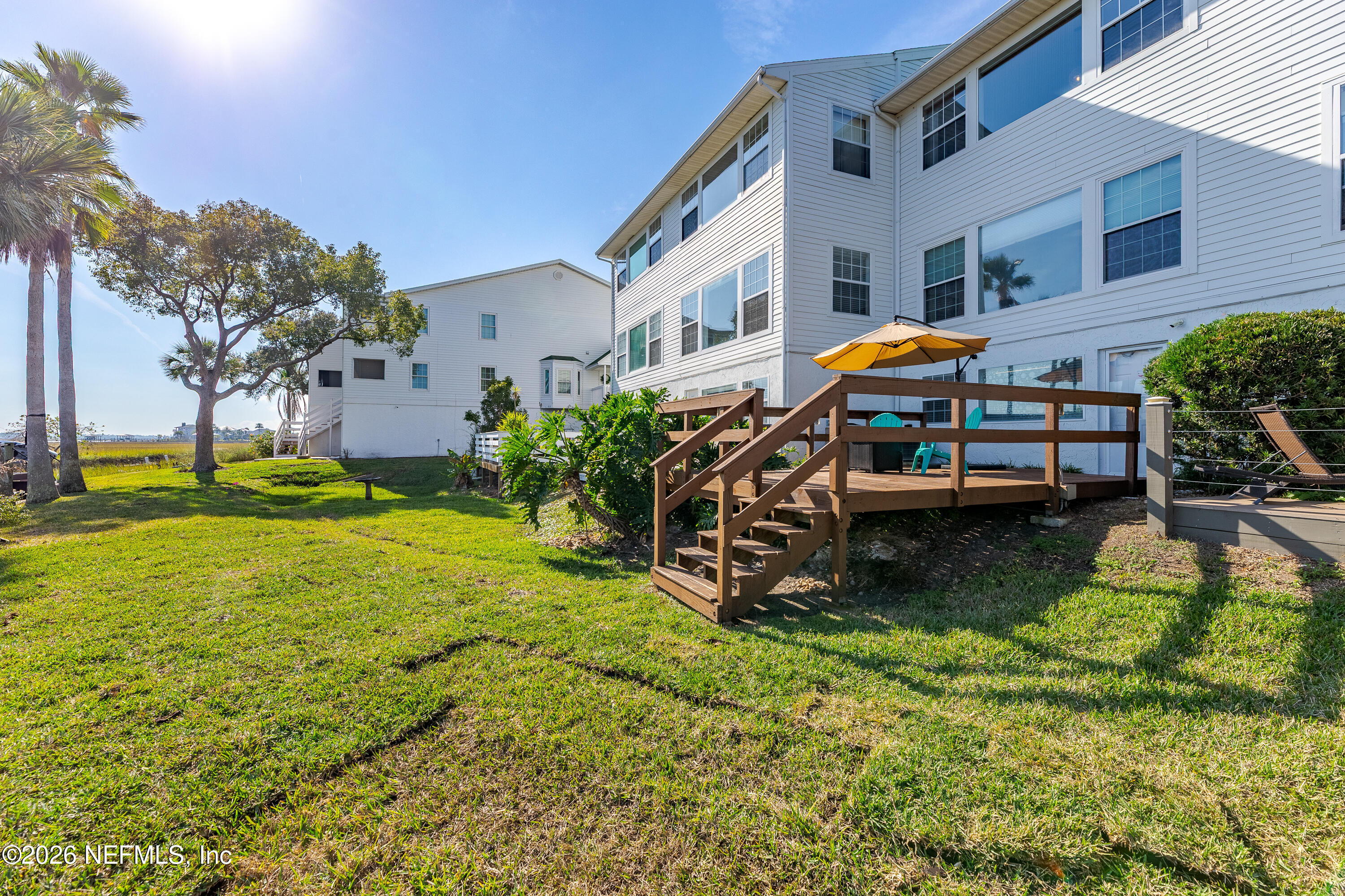 3327 Lighthouse Point Lane Jacksonville, FL 32250 - Photo 44 of 56 a view of a house with backyard and sitting area