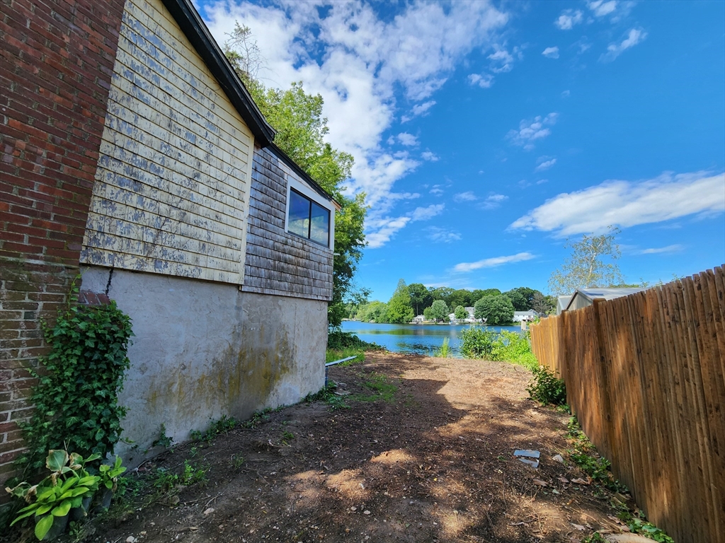 4 West Shore Road Holbrook, MA 02343 - Photo 3 of 35 a backyard of a house with a yard