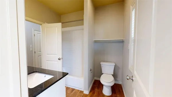 a bathroom with a toilet and a sink