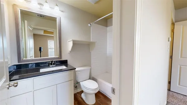 a bathroom with a sink and a toilet