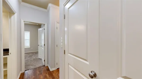 a view of a bathroom from a hallway