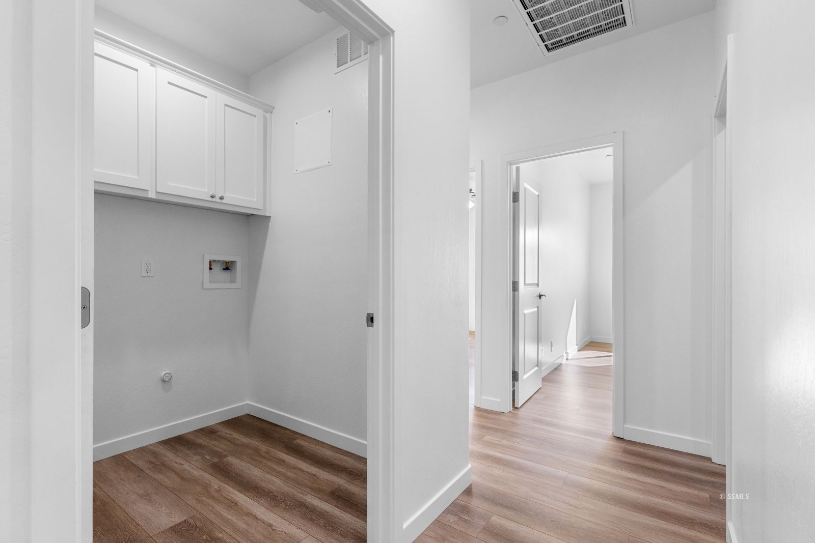 1112 Vulcan Ridgecrest, CA 93555 - Photo 12 of 30 a view of a hallway with wooden floor and closet