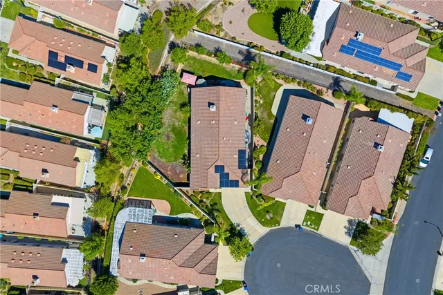 an aerial view of a house with a swimming pool
