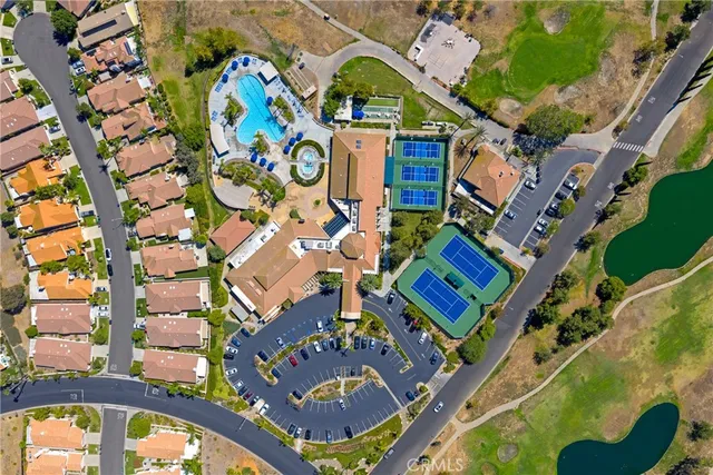 an aerial view of a house with a swimming pool