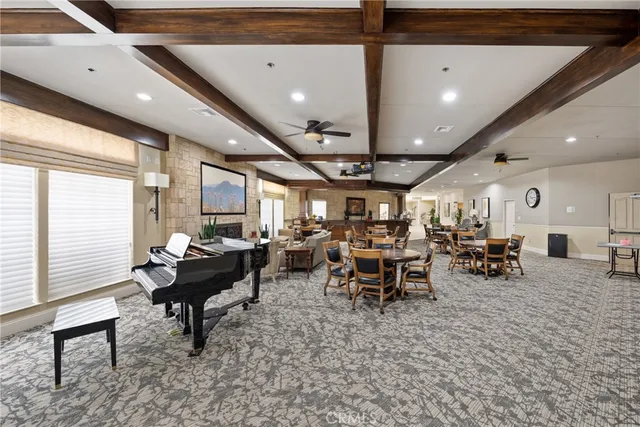 a living room with lots of furniture and a large window