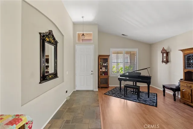 a view of a livingroom with furniture and wooden floor