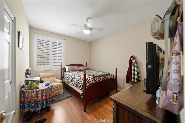 a bedroom with two beds and a window