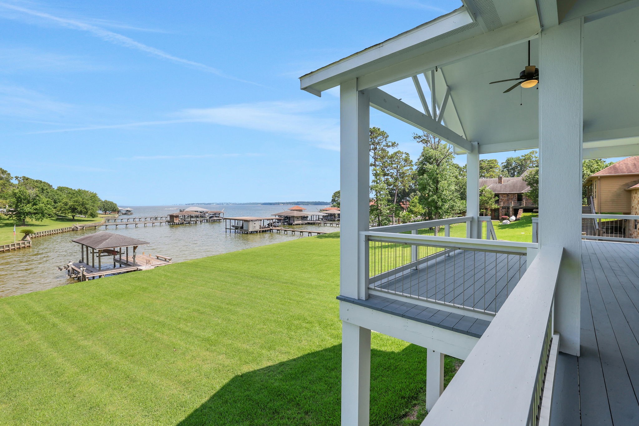231 Ridge Cove Lane Coldspring, TX 77331 - Photo 30 of 50 Enjoy front-row views of Lake Livingston, where you can watch boats glide by and summer storms roll across the water