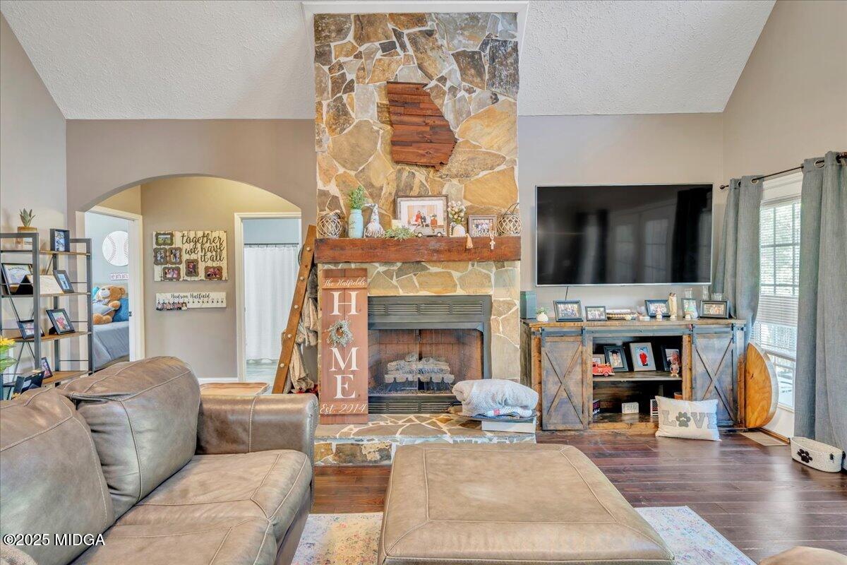 16 Little Collier Road Forsyth, GA 31029 - Photo 11 of 55 a living room with furniture and a fireplace