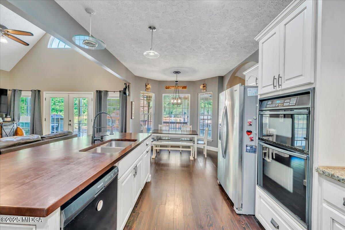 16 Little Collier Road Forsyth, GA 31029 - Photo 15 of 55 a kitchen with granite countertop a stove oven and sink