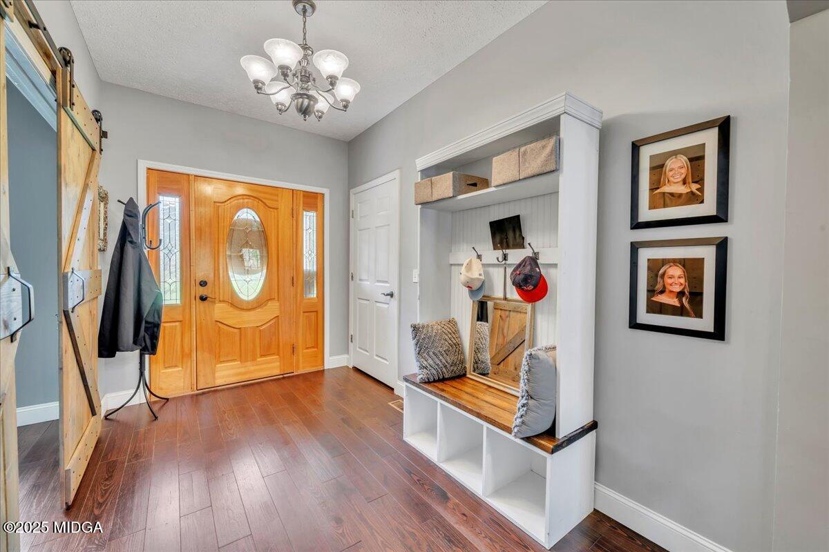 16 Little Collier Road Forsyth, GA 31029 - Photo 17 of 55 a view of a hallway with wooden floor and workspace