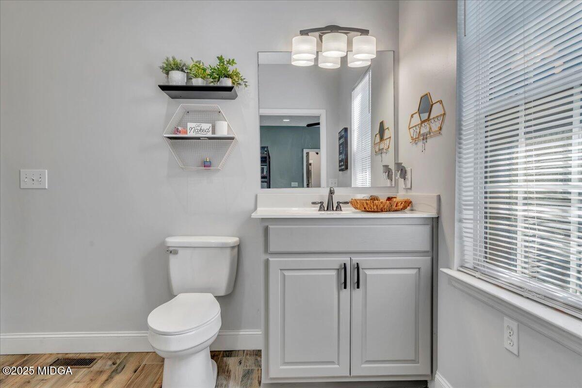 16 Little Collier Road Forsyth, GA 31029 - Photo 19 of 55 a bathroom with a toilet sink and mirror