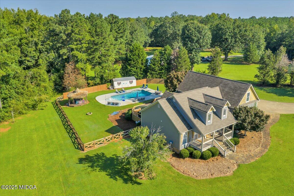16 Little Collier Road Forsyth, GA 31029 - Photo 2 of 55 an aerial view of a house with swimming pool a yard and mountain view
