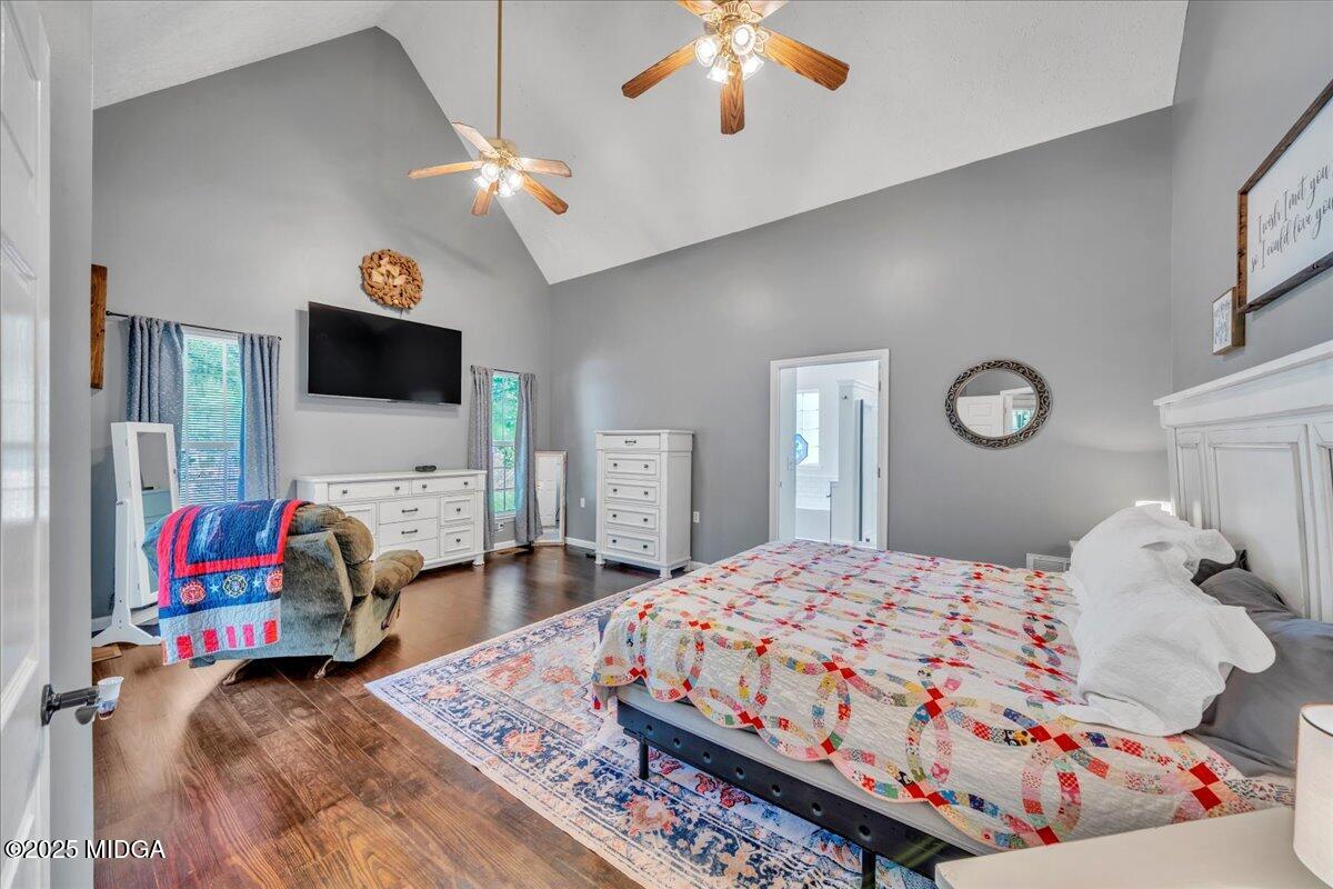 16 Little Collier Road Forsyth, GA 31029 - Photo 21 of 55 a bedroom with a bed and a flat screen tv