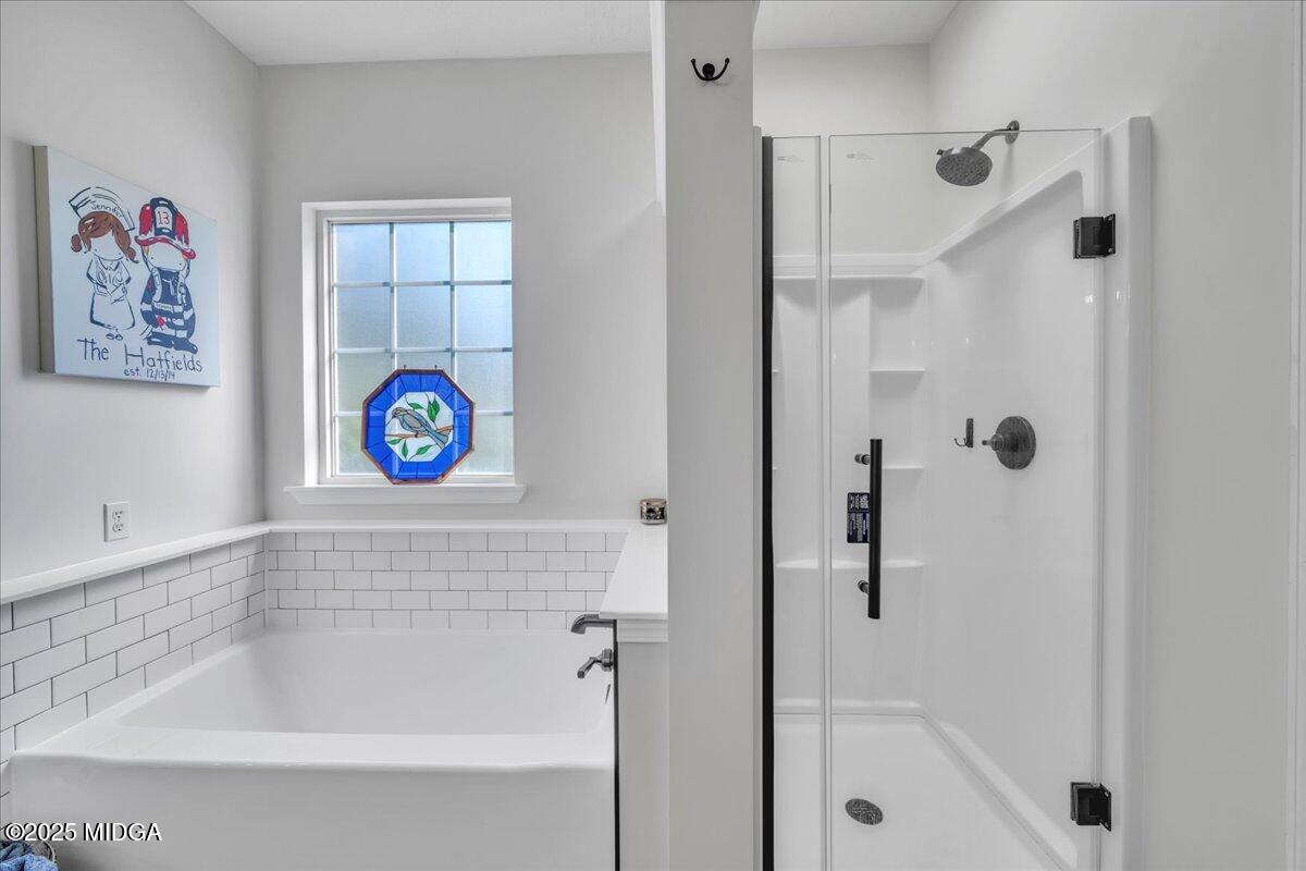 16 Little Collier Road Forsyth, GA 31029 - Photo 29 of 55 a bathroom with a bathtub and a shower