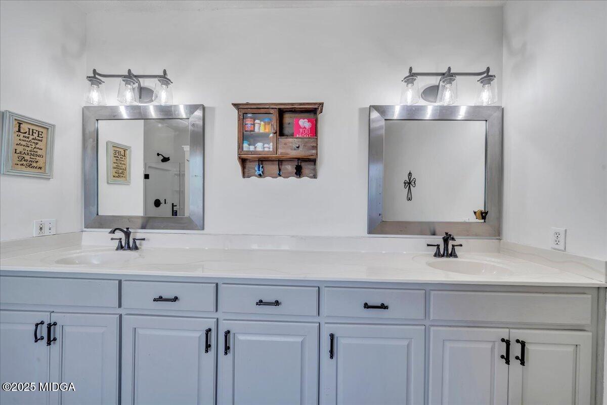 16 Little Collier Road Forsyth, GA 31029 - Photo 30 of 55 a bathroom with double vanity sinks a vanity and a mirror