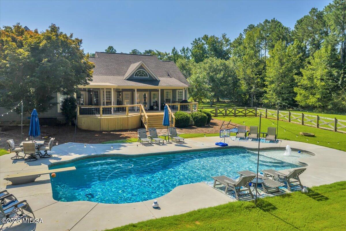 16 Little Collier Road Forsyth, GA 31029 - Photo 3 of 55 a view of a house with backyard porch and sitting area