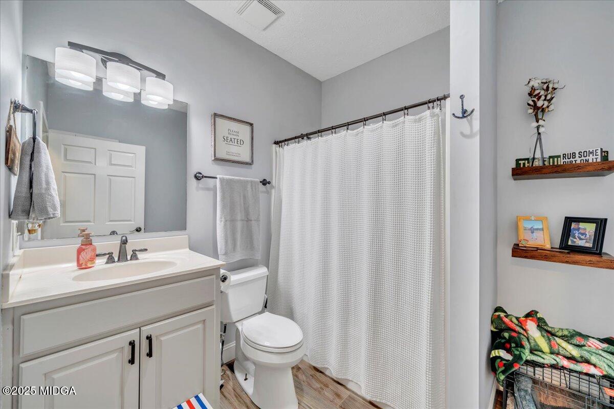 16 Little Collier Road Forsyth, GA 31029 - Photo 36 of 55 a bathroom with a sink toilet and shower