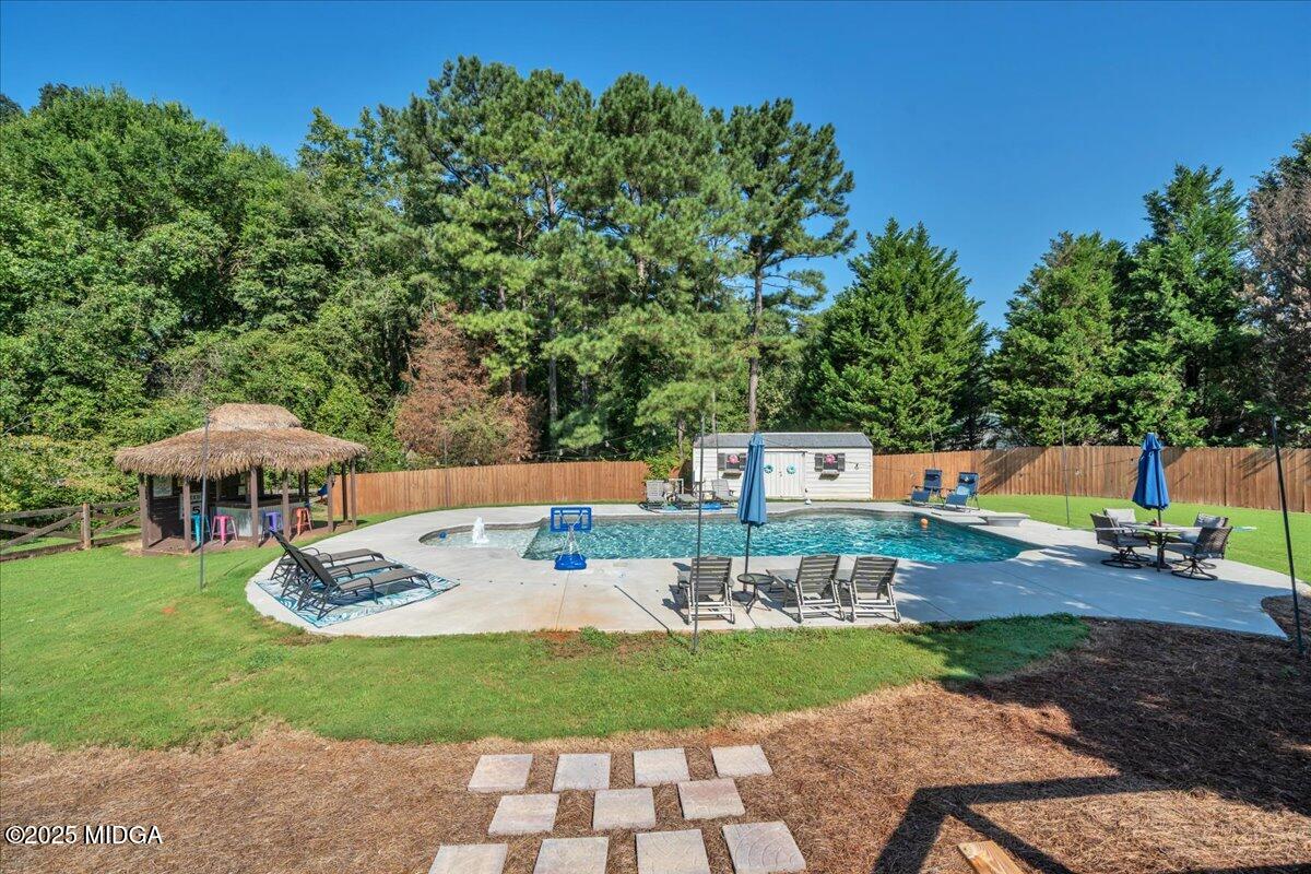 16 Little Collier Road Forsyth, GA 31029 - Photo 41 of 55 a view of a house with backyard and sitting area