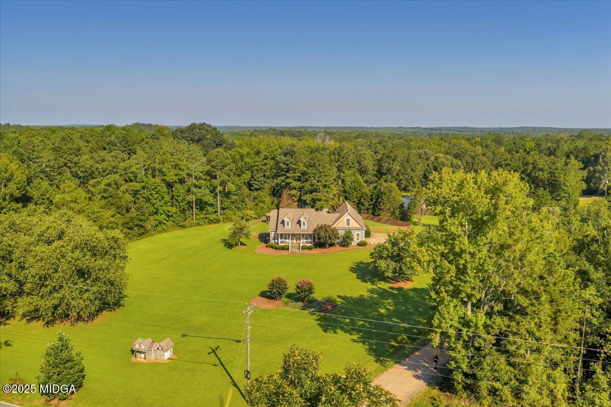 16 Little Collier Road Forsyth, GA 31029 - Photo 52 of 55 a view of a lake with houses in the back