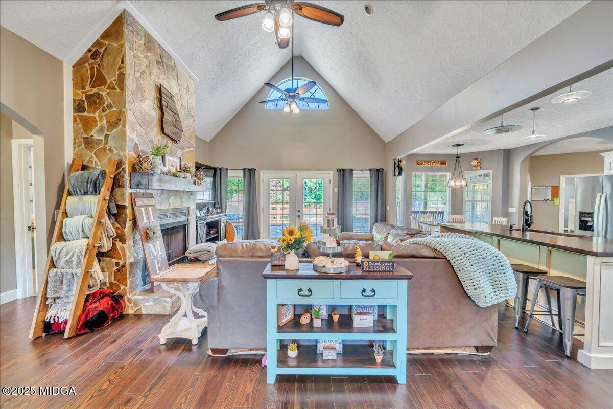 16 Little Collier Road Forsyth, GA 31029 - Photo 6 of 55 a living room with fireplace furniture and a wooden floor