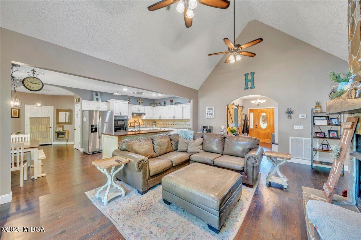 16 Little Collier Road Forsyth, GA 31029 - Photo 8 of 55 a living room with furniture and a chandelier