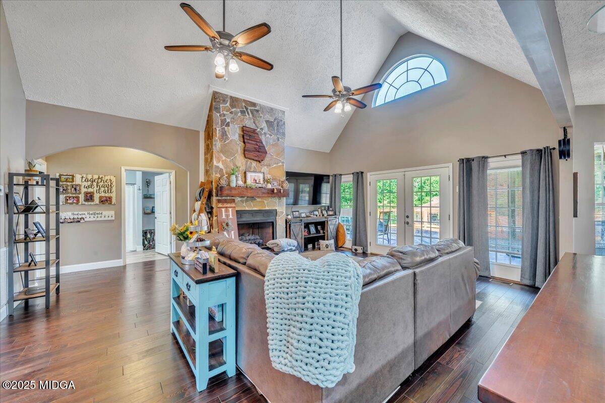16 Little Collier Road Forsyth, GA 31029 - Photo 10 of 55 a living room with furniture a fireplace and a chandelier