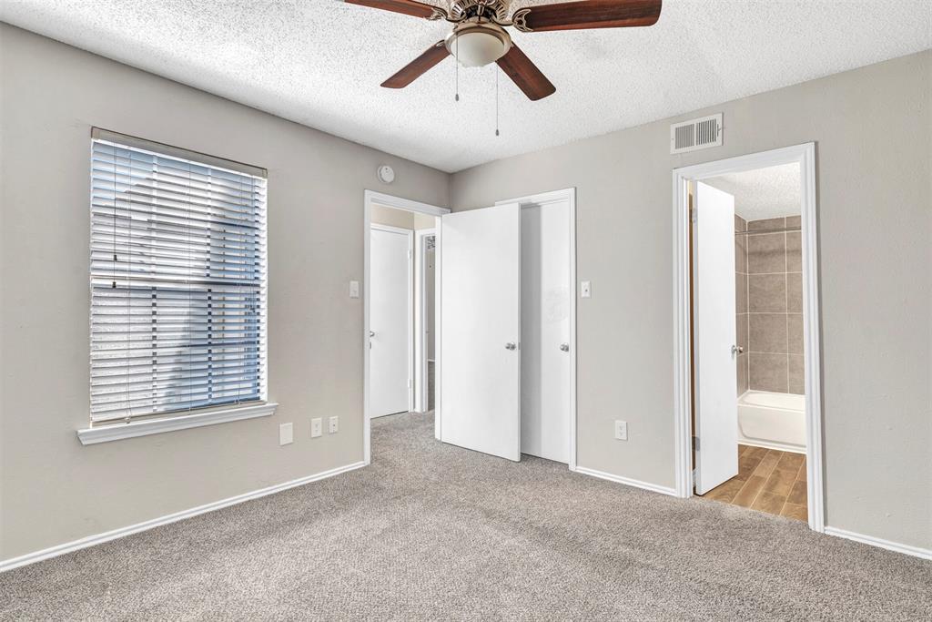 11311 Audelia Road, Unit 271 Dallas, TX 75243 - Photo 12 of 17 1 of 2 bedrooms upstairs with ensuite bath