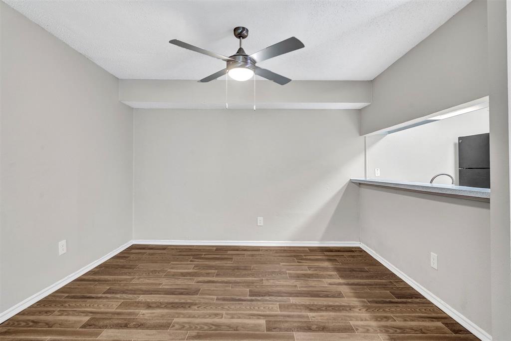 11311 Audelia Road, Unit 271 Dallas, TX 75243 - Photo 14 of 17 View from dining looking towards entry and stairway
