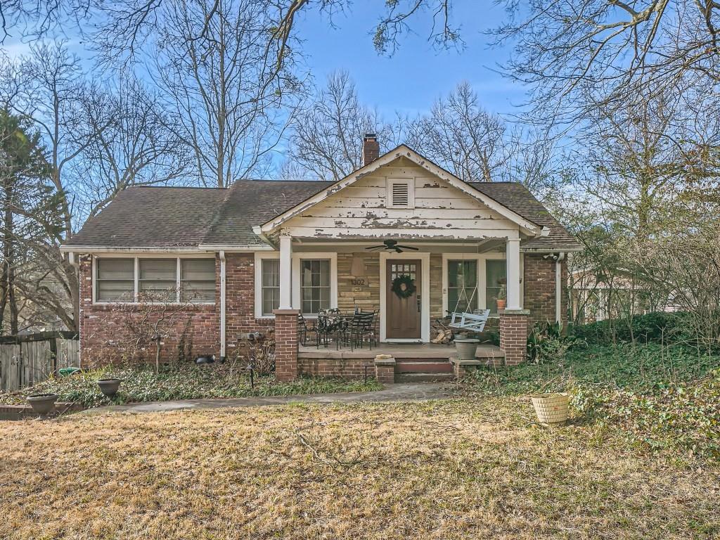 1302 McLendon Drive Decatur, GA 30033 - Photo 1 of 1 a front view of a house with garden