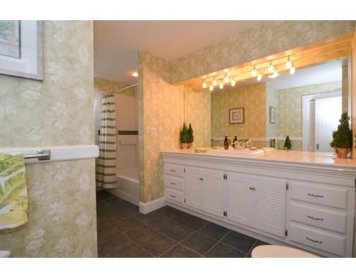 143 Overlook Road Arlington, MA 02474 - Photo 21 of 28 a bathroom with a double vanity sink a mirror and a shower
