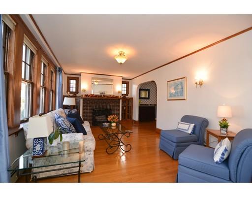 143 Overlook Road Arlington, MA 02474 - Photo 5 of 28 a living room with furniture a fireplace and a flat screen tv