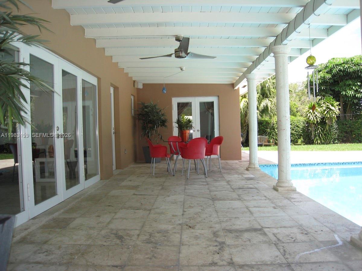 7440 Southwest 126th Street Pinecrest, FL 33156 - Photo 11 of 22 a view of a hall with an outdoor space
