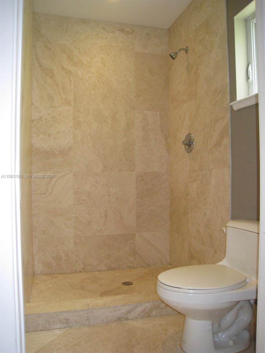 7440 Southwest 126th Street Pinecrest, FL 33156 - Photo 14 of 22 a bathroom with a sink a toilet and shower