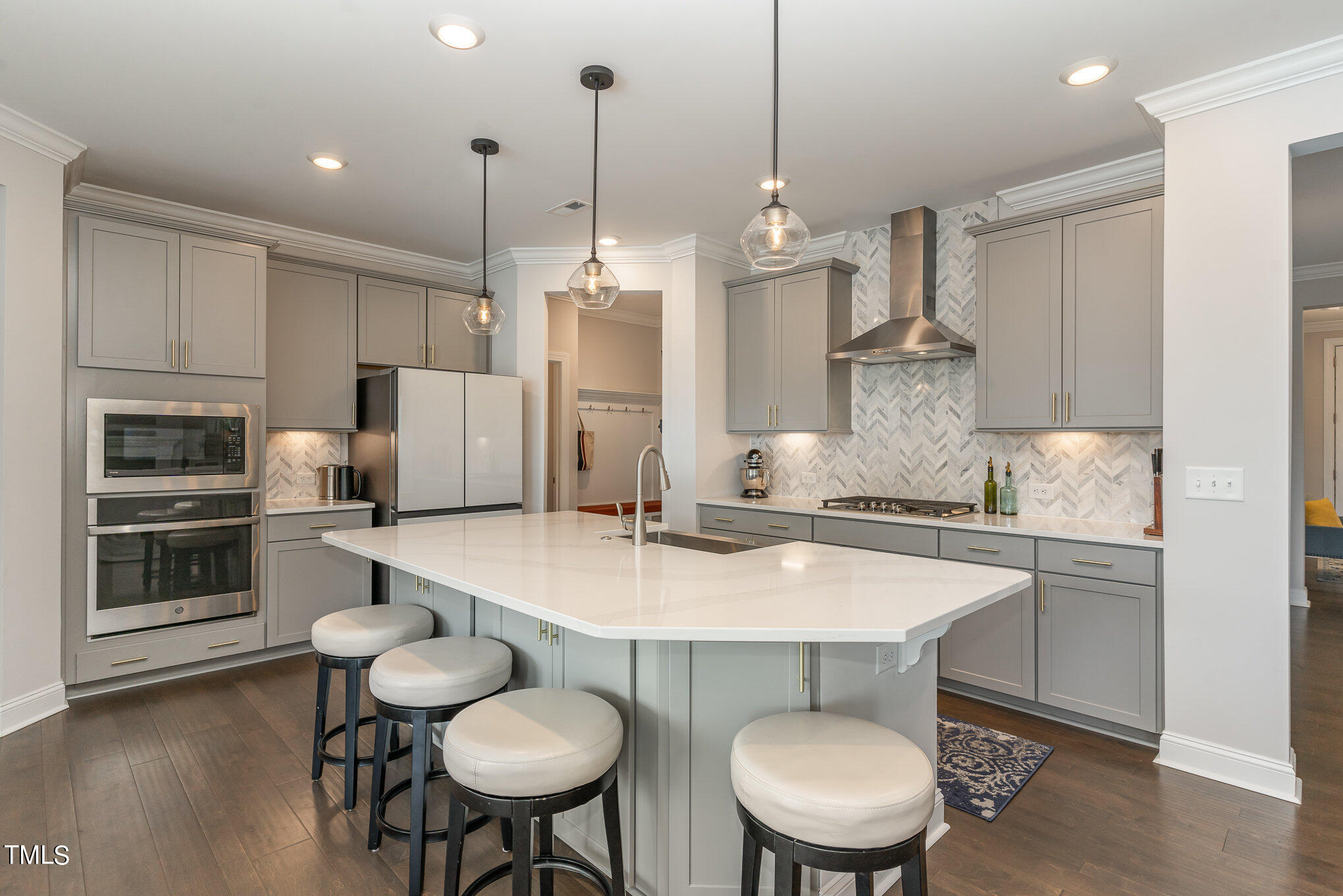171 High Woods Ridge Pittsboro, NC 27312 - Photo 11 of 51 a kitchen with stainless steel appliances a table chairs stove and kitchen view