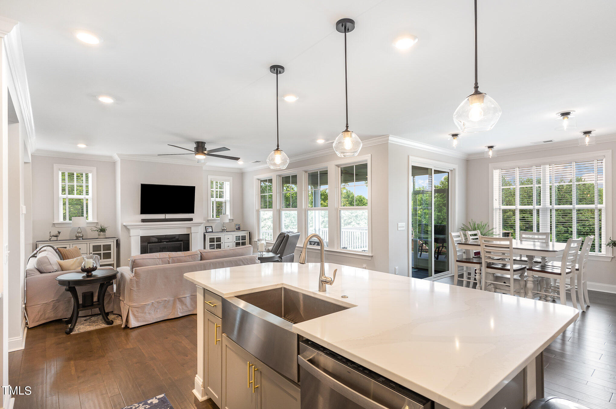 171 High Woods Ridge Pittsboro, NC 27312 - Photo 15 of 51 a large kitchen with kitchen island a stove a sink a living room and living room view
