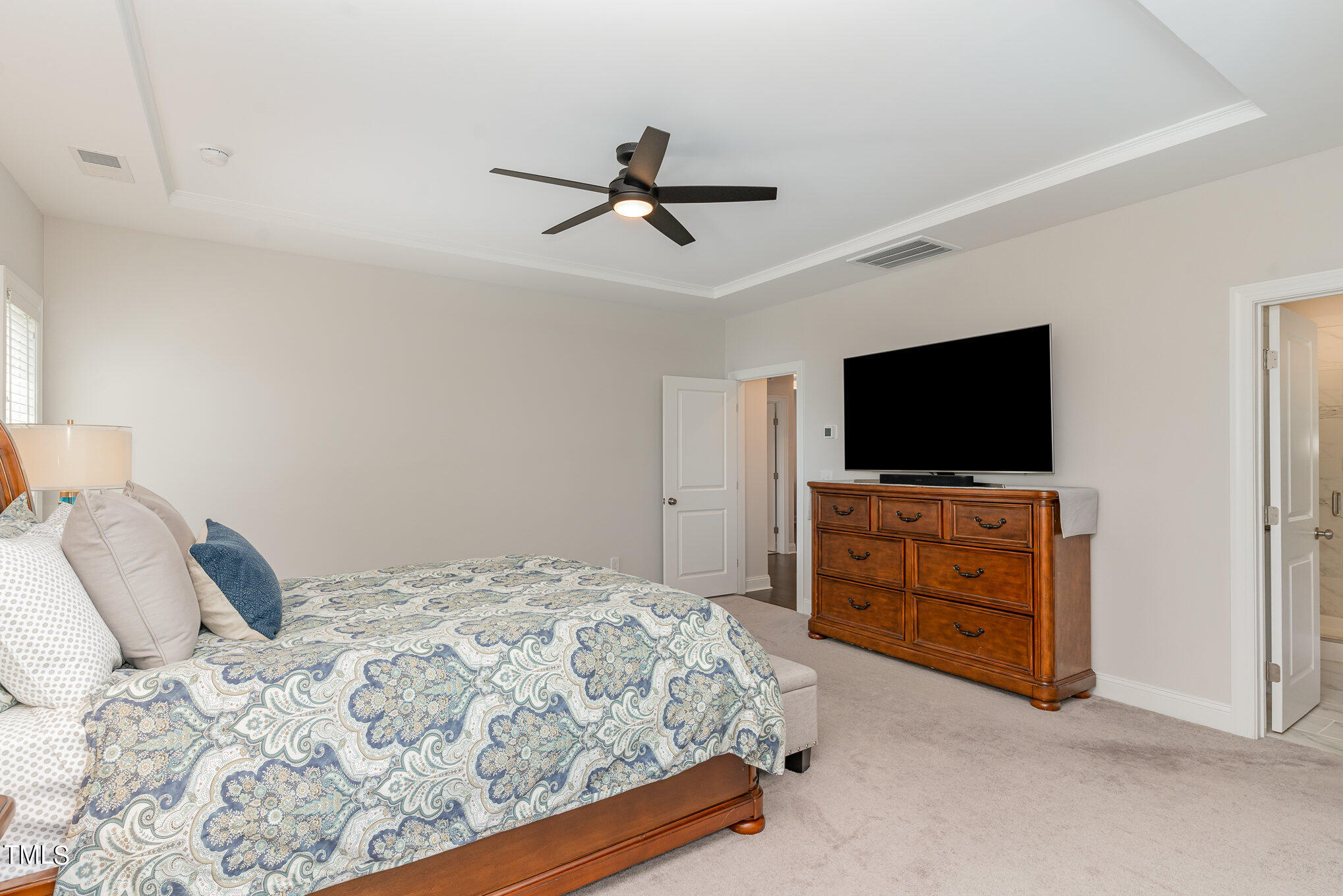 171 High Woods Ridge Pittsboro, NC 27312 - Photo 18 of 51 a bedroom with a bed and a flat screen tv