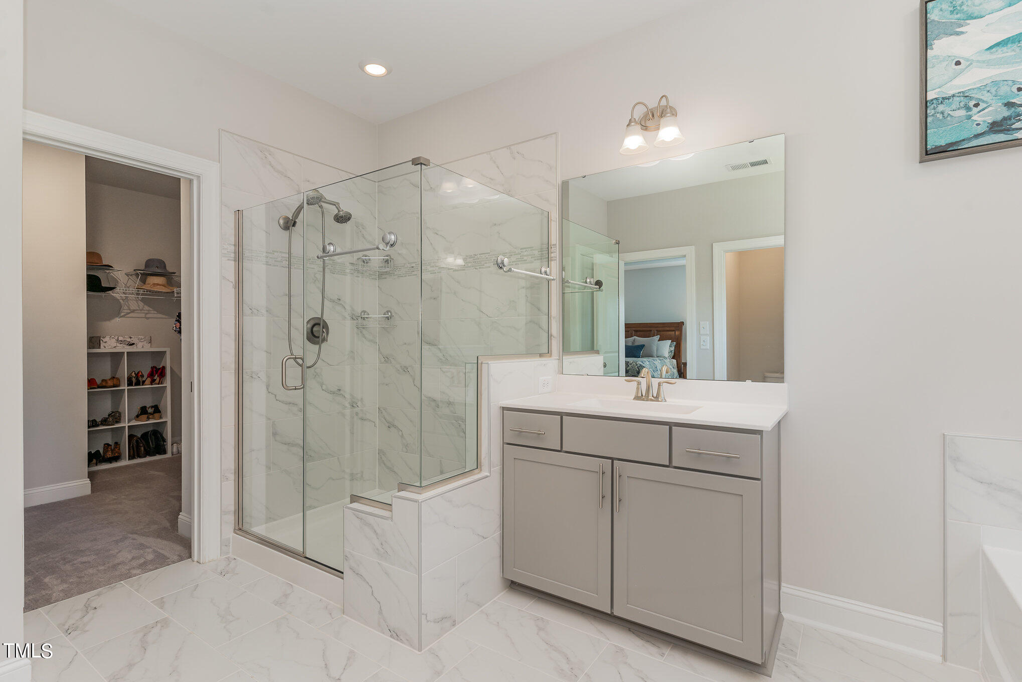 171 High Woods Ridge Pittsboro, NC 27312 - Photo 20 of 51 a bathroom with a shower sink and mirror