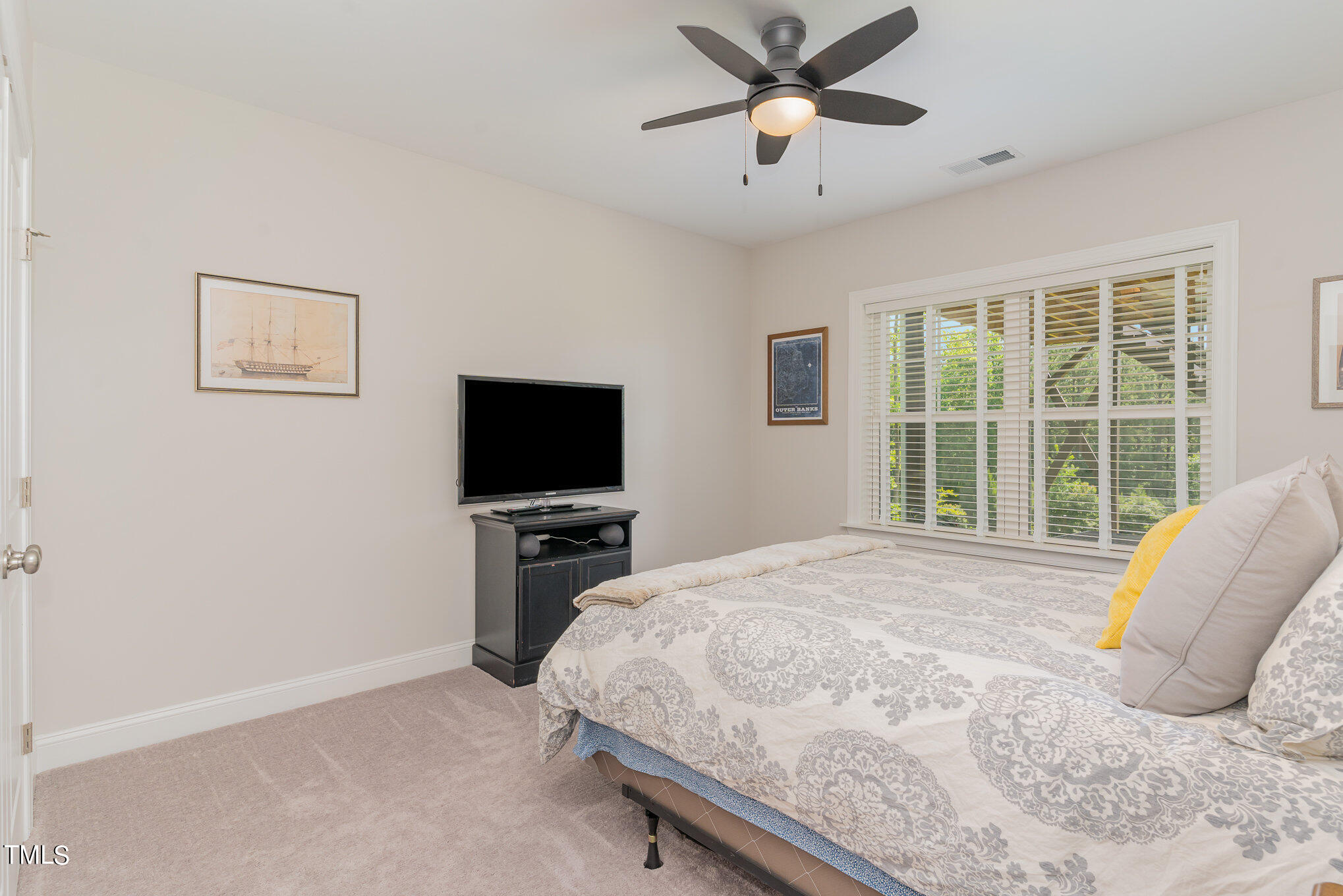 171 High Woods Ridge Pittsboro, NC 27312 - Photo 24 of 51 a bedroom with a bed and a flat screen tv