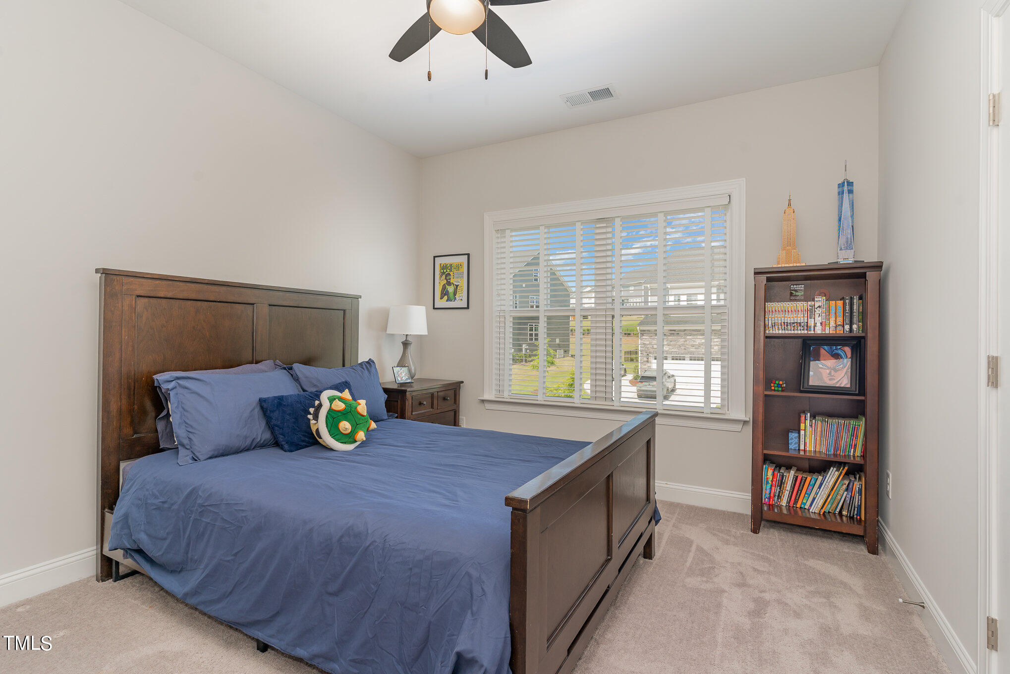 171 High Woods Ridge Pittsboro, NC 27312 - Photo 26 of 51 a bed sitting in a bedroom next to a window