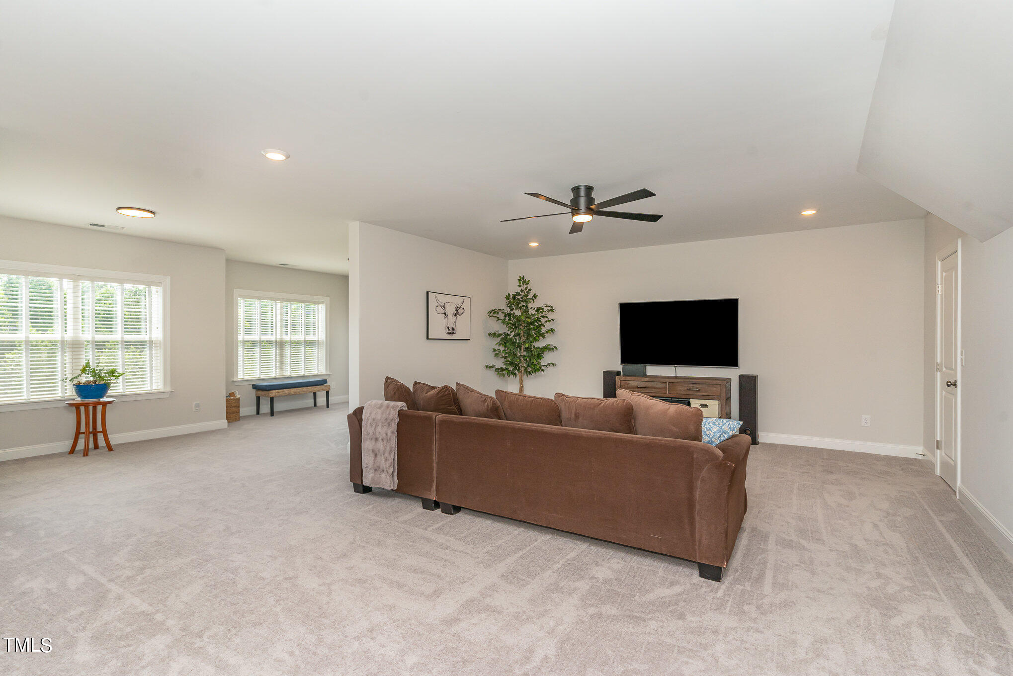 171 High Woods Ridge Pittsboro, NC 27312 - Photo 30 of 51 a living room with furniture and a flat screen tv