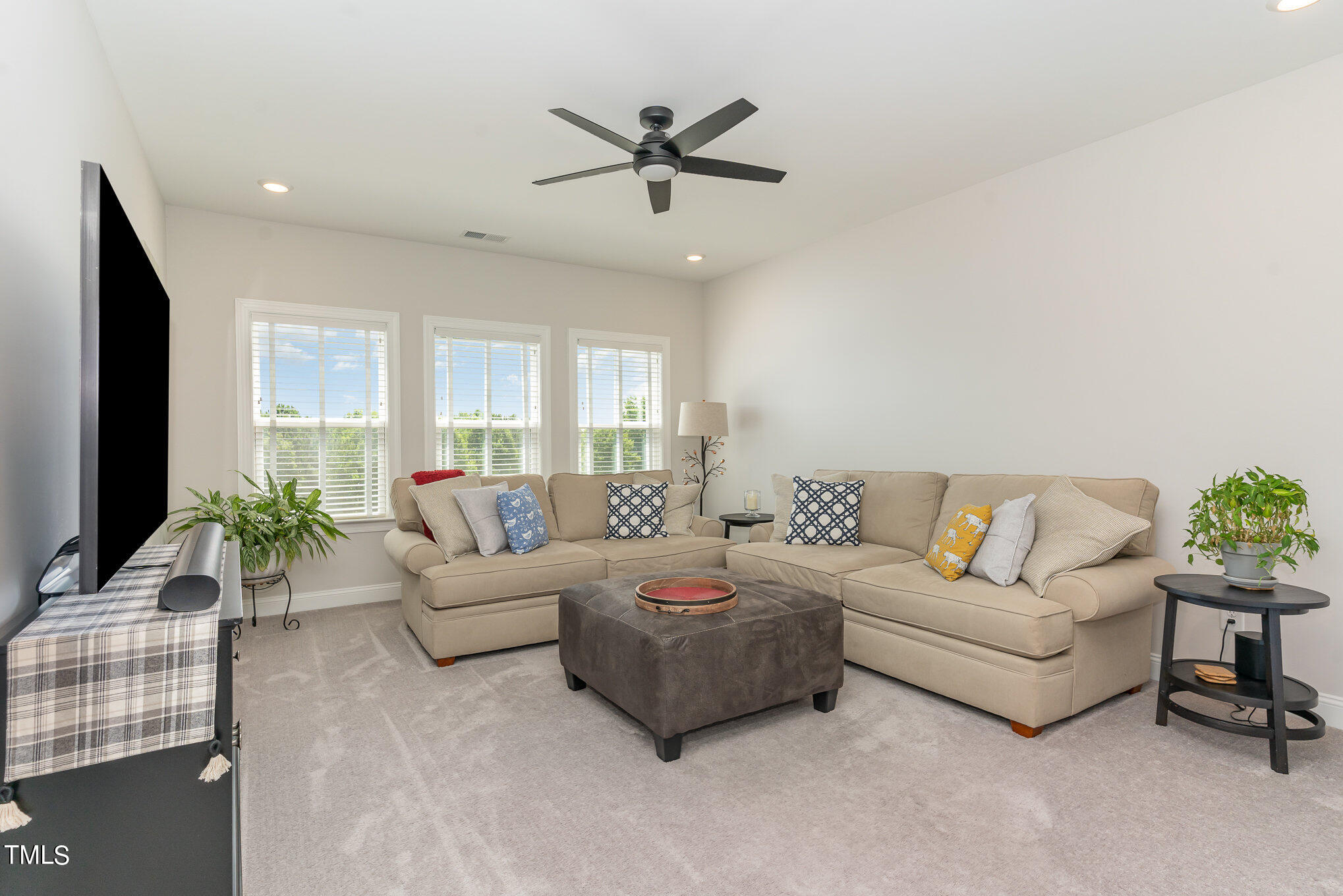 171 High Woods Ridge Pittsboro, NC 27312 - Photo 32 of 51 a living room with furniture and a large window with wooden floor