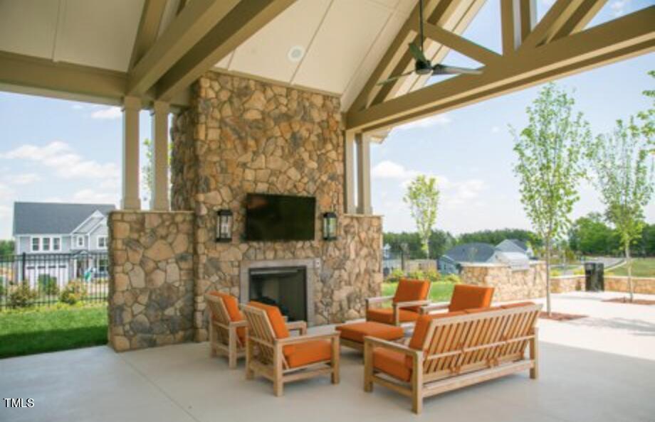 171 High Woods Ridge Pittsboro, NC 27312 - Photo 48 of 51 a outdoor living space with patio furniture and a fireplace